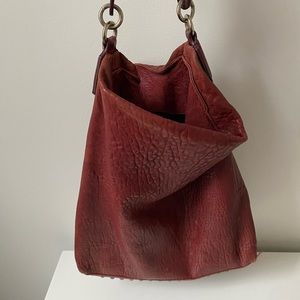 ALEXANDER WANG leather bucket bag with gold spikes on bottom